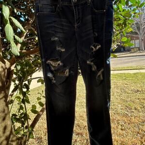 Distressed blue denim ripped jeans